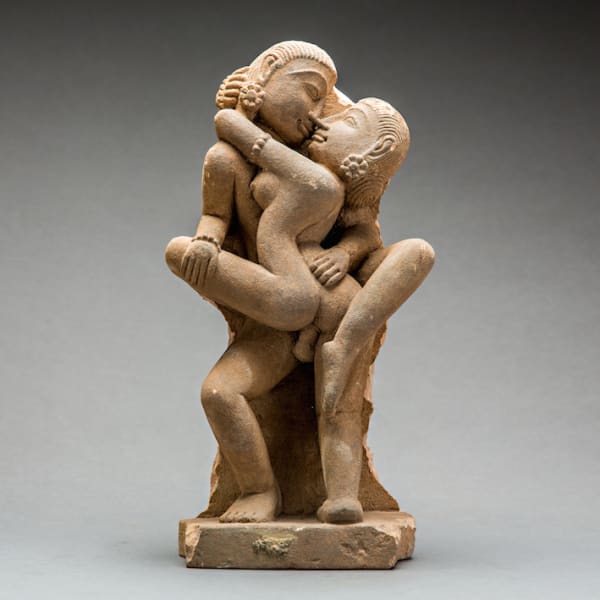 Sandstone carved relief of a love-making couple