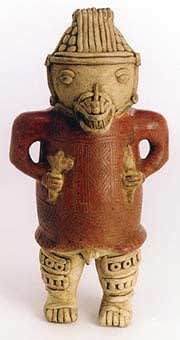 Sculpture of a Standing Saurian Deity Holding Rattles