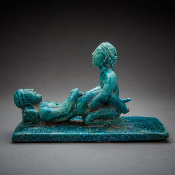 Faience figurines of a male couple engaging in sexual activity