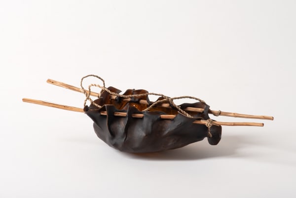 Vanessa Greeno Pakana water carrier, 2025 bull kelp, tea tree, river reed 8 x 12 x 36 cm