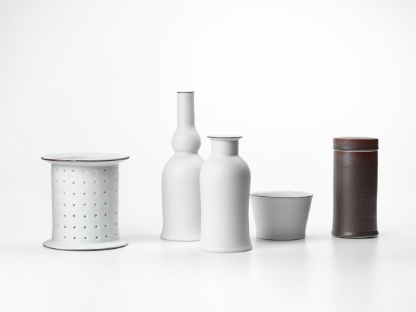 Kirsten Coelho Deliberation, 2019 porcelain matt white glaze , iron oxide saturated iron glaze 5 Pieces: 25cm H x 60cm L x 25 cm W