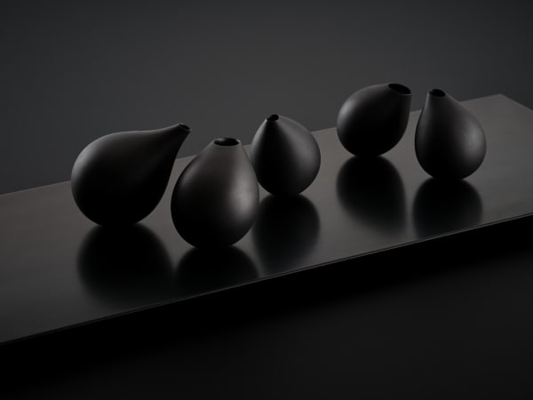 Belinda Winkler With Their Own Quiet Gravity, 2025 5 porcelain & graphite forms on steel base 30 x 84 cm (overall size)