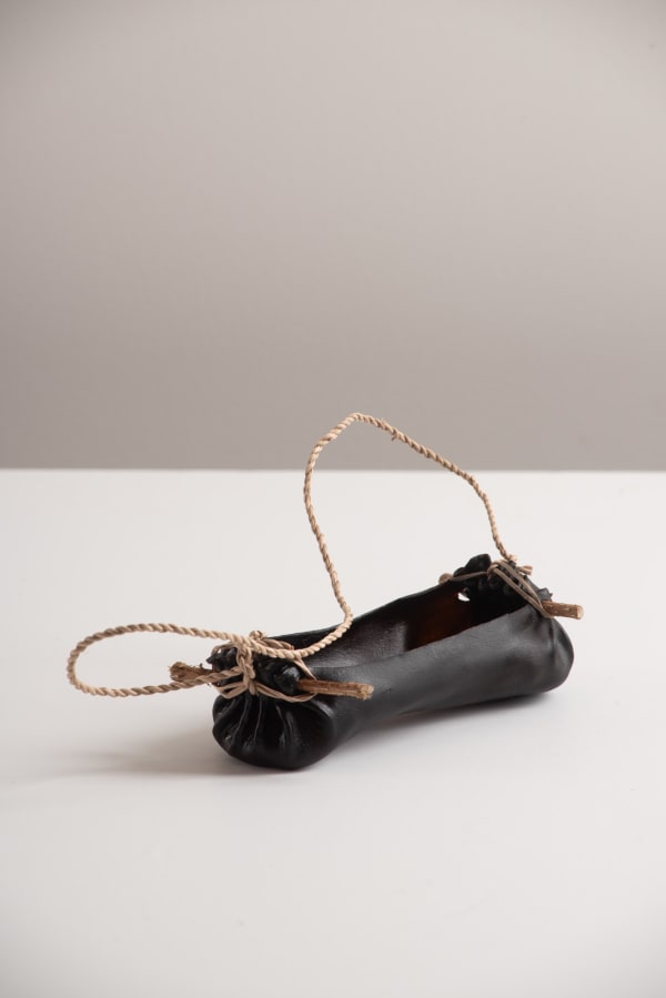 Tracy Purdon pakana water carrier, 2024 bull kelp, flax & tea-tree 5 x 8 x 16 cm (carrier size length) 42 cm (string length)