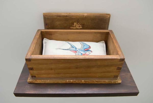 Julie Gough Kidnapped, 2007 Ink on leather, lead shot & wooden box on shelf 23 x 25 x 17 cm