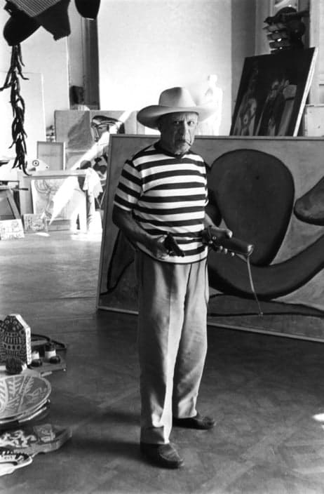 René Burri, Pablo Picasso, Villa "La Californie", "Woman throwing a stone" (1931), hat and holster given to him by Gary Cooper, Cannes, France, Vintage, 1957