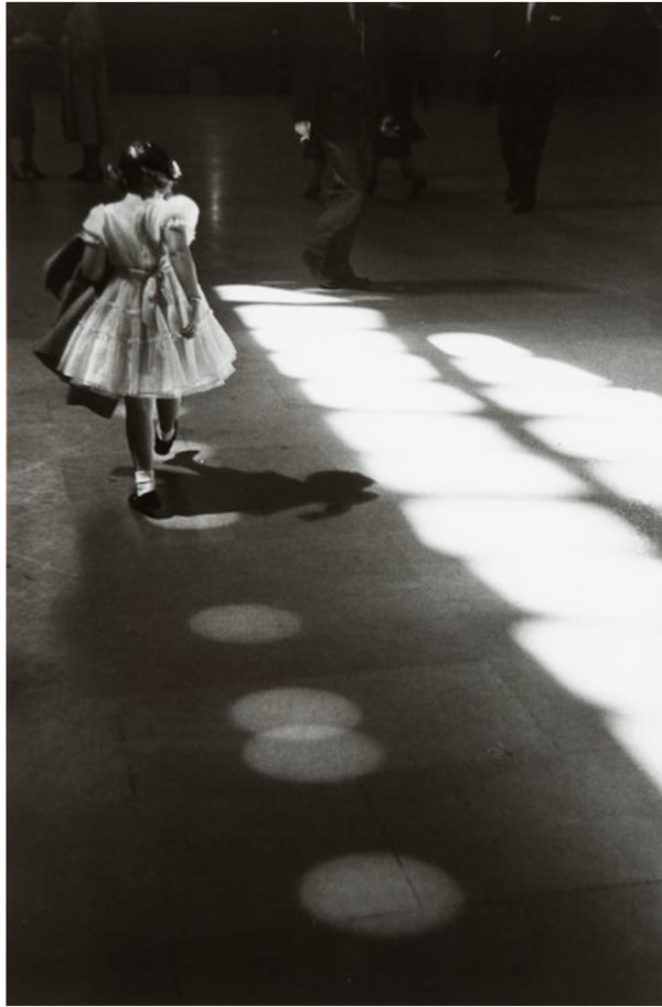 Louis Stettner, Girl Playing in Light Circles, Penn Station, 1958