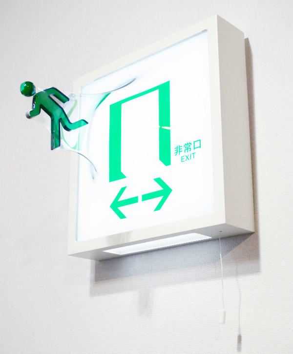 3D exit sign wall sculpture made with Mixed media