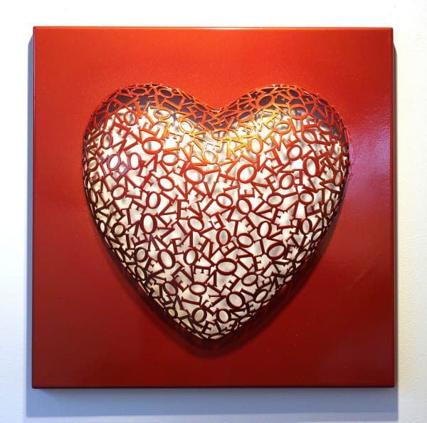 Heart shaped wall sculpture made with the ltters "Love"