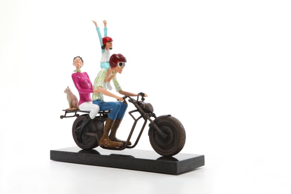 Contemporary sculpture of family riding a motorcycle