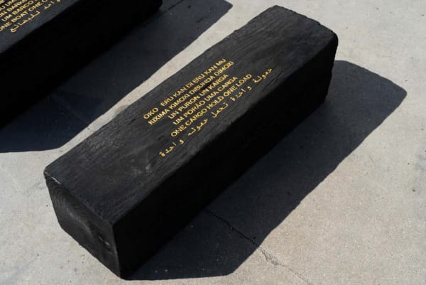 Grada Kilomba Untitled Poem (one cargo hold, one load), 2022 Charcoal log with gold leaf engraving 11 3/4 x 11 3/4 x 35 3/8 inches 30 x 30 x 90 cm