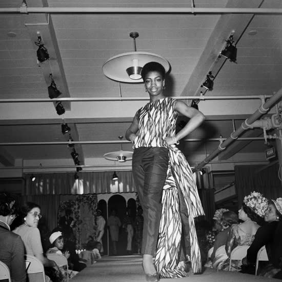 Kwame Brathwaite, Untitled (Nomsa Brath modeling Congolese fabrics, Stern's department store, New York), 1963 c., printed 2019