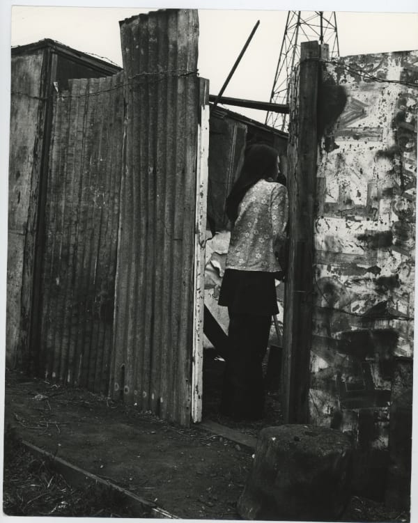 Jo Spence, Gypsies (woman with corrugated iron), 1974