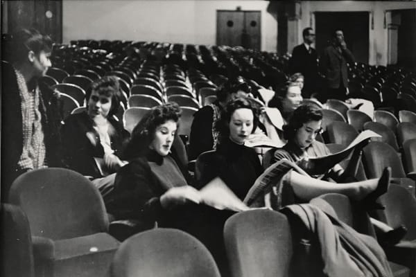 Bert Hardy, Bluebell Girls (reading the newspaper), 1954