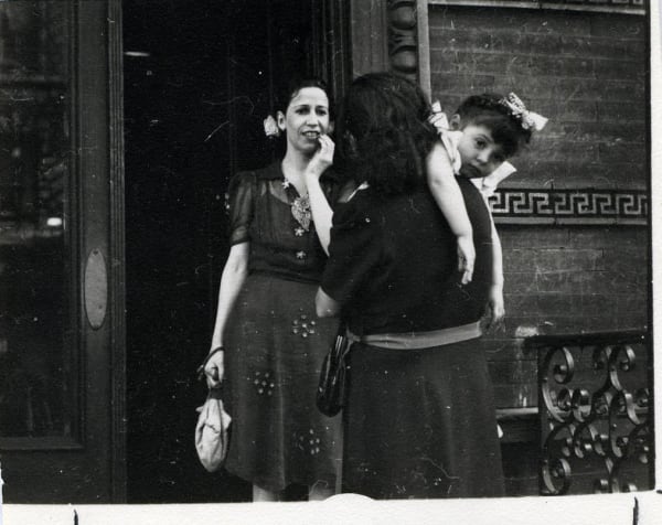 Untitled (Two women and a girl by a doorway)