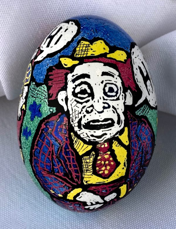 dyed egg showing man in suit saying Hi