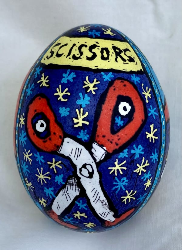 pysanky egg showing scissors