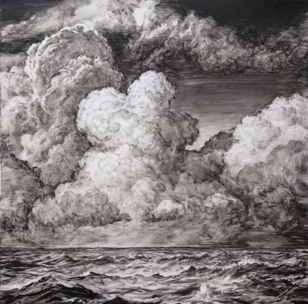 black and white image of ocean waves and dramatic clouds