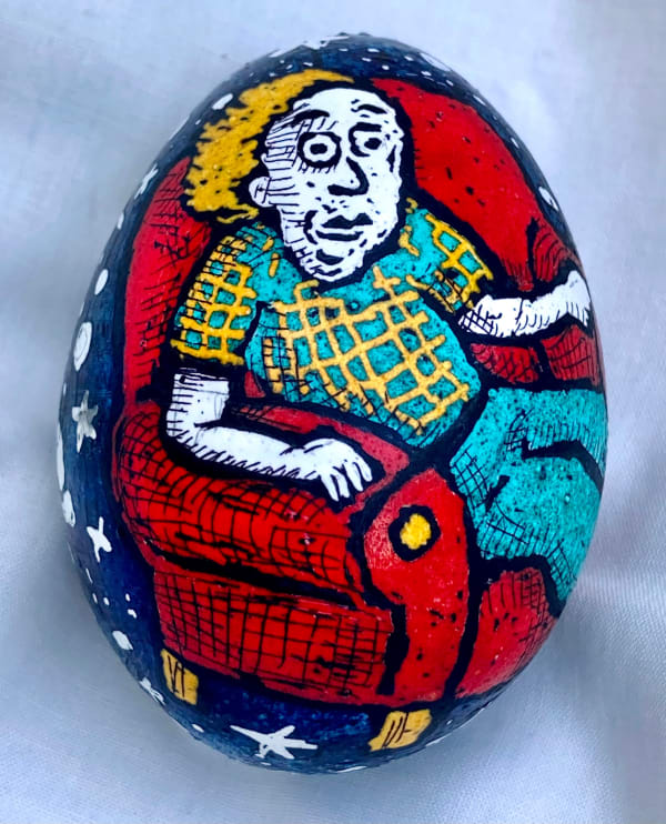 dyed egg showing man in red chair