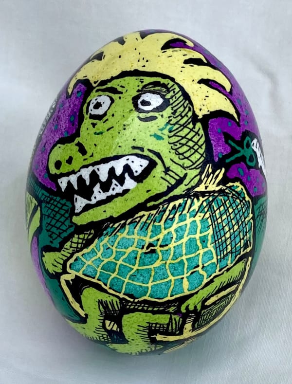 Pysanky egg showing dinosaur in a barber shop