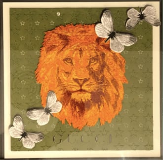 “GUCCI STRENGTH XXVII”, painting by Stephen Wilson artist from Charlotte, North Carolina. Available at Carousel Fine Art Atlanta. The artist’s technique transforms up-cycled luxury items like bags and scarves into extraordinary designs. Using meticulous hand-stitched embroidery, the artist reinterprets textiles, creating unique pieces that explore luxury consumerism. Each artwork is framed in acrylic, ready to captivate its audience. Colors of this work : Green, Yellow, Orange, Brown, Grey, White, Black