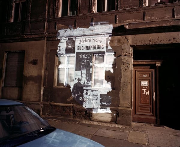 Shimon Attie, Almadstrasse 43 (formerly Gradierstrasse 7): Slide projection of former Hebrew bookstore, 1930, Berlin, 1993