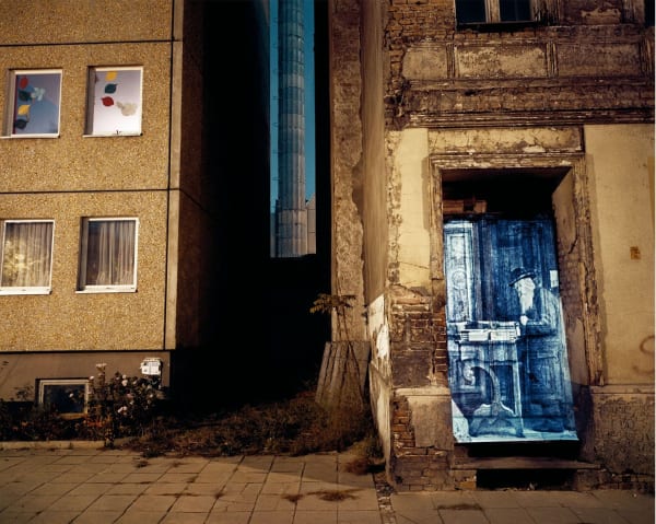Shimon Attie, Almadstrasse (formerly Gradierstrasse)/ corner Schendelgasse: Slide projection of former religious book salesman, 1930, Berlin, 1993