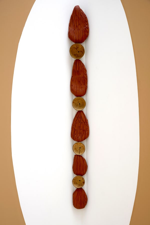Lucía Pizzani Cadena, 2024 Red stoneware clay and dried coconuts 160 x 17 x 11 cm 63 x 6 3/4 x 4 3/8 in