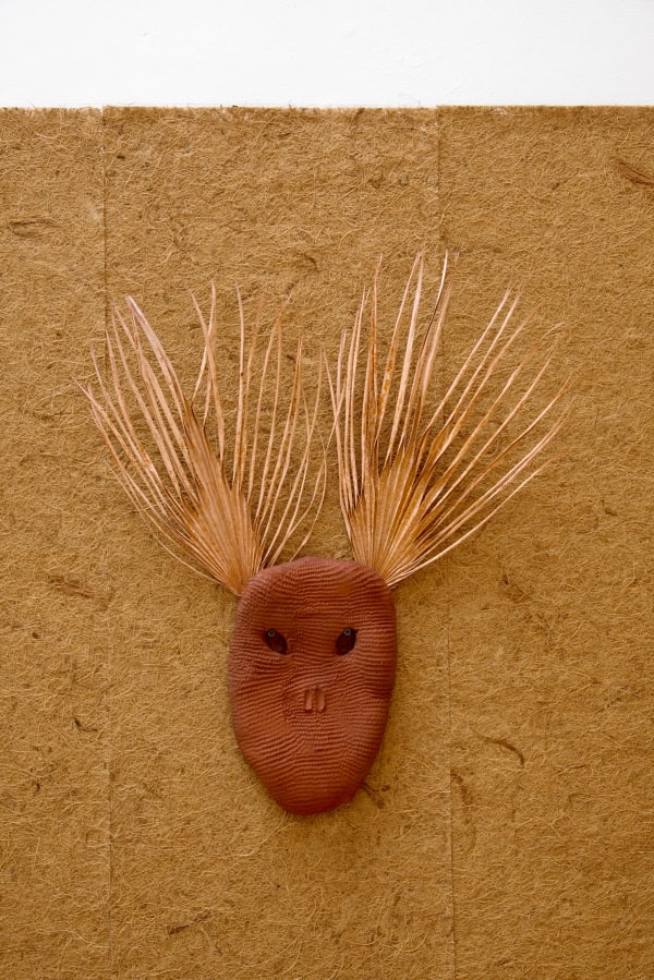 Lucía Pizzani Roja Palmas, 2024 Red stoneware clay and dried treated palm leaves 66 x 20 x 3.5 cm 26 x 7 7/8 x 1 3/8 in
