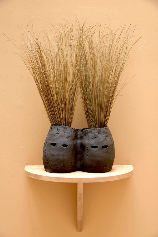 Lucía Pizzani Siamesas, 2024 Black stoneware clay and dried palm stems 36 x 22 x 76 cm 14 1/8 x 8 5/8 x 29 7/8 in