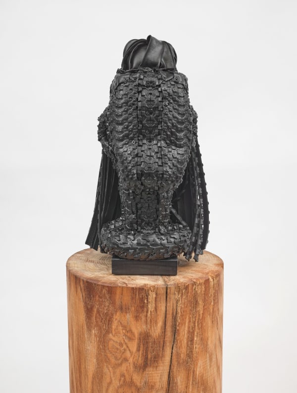 Kim Dacres Rashida, 2023 Recycled auto, motorcycle, electric skateboard, and bicycle tires, pressure treated wood, construction screws, MDF, and black satin spray paint mounted on red oak plinth 21 1/2 x 10 x 13 inches (54.6 x 25.4 x 33 cm) Plinth: 38 x 13 1/2 inches (96.5 x 34.3 cm)