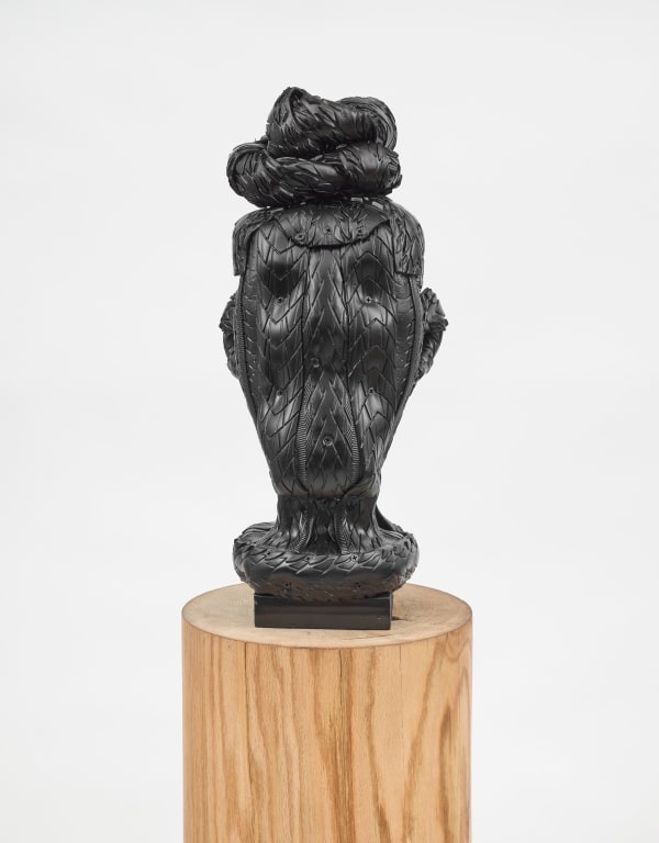 Kim Dacres Misha, 2023 Recycled auto, motorcycle, electric skateboard, and bicycle tires, pressure treated wood, construction screws, and black satin spray paint mounted on red oak plinth 23 x 10 x 10 1/4 inches (58.4 x 25.4 x 26 cm) Plinth: 42 x 13 1/4 inches (106.7 x 33.7 cm)