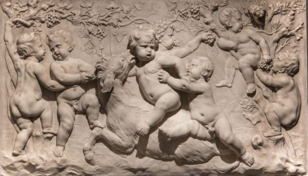 JAN BAPTIST XAVERY, A pair of marble reliefs with playful putti