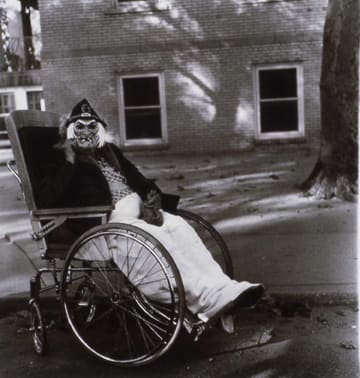 Diane Arbus, Masked Woman in a Wheelchair, 1970