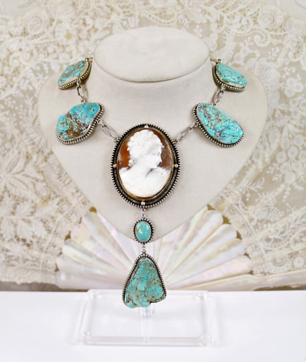 Jill Garber, A fabulous collection of natural American mined turquoise nougats form the unique foundation for an important large, hand carved 19th Century cameo depicting an aristocratic lady