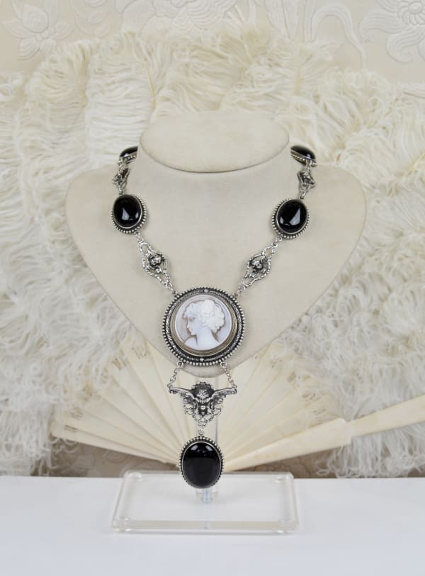Jill Garber, ANTIQUE ART DECO HAND CARVED CAMEO DEPICTING AND ARISTOCRATIC DEBUTANT ON IMPRESSIVE BLACK ONYX WITHIN UNIQUE ORIGINAL ROCOCO STYLE FIGURAL ANGEL COMPONENT CHAIN.