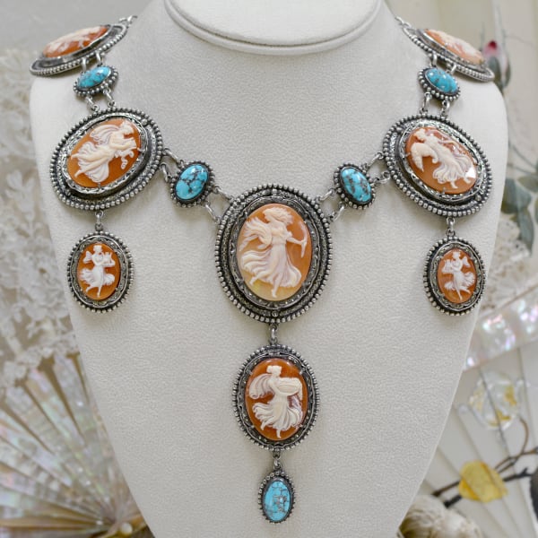Jill Garber, COMPLEX MULTI CHAIN ELONGATED BIB NECKLACE WITH NINETEENTH CENTURY CUPID KISS CAMEO SURROUNDED WITH ROYSTON TURQUOISE