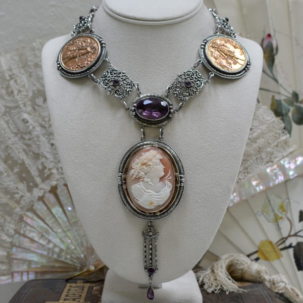 Jill Garber, STUNNING 45 CARAT FACETED AMETHYST DROP NECKLACE WITH BRONZE MEDALLIONS, AUSTRO HUNGARIAN LINKS AND FRENCH PASTE DROP