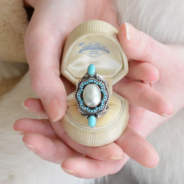 Jill Garber, A divine statement ring meticulously hand crafted with an early Victorian 19th Century natural mother of pearl surrounded with Persian Turquoise