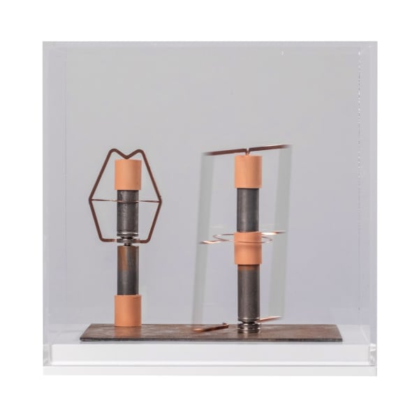 Deborah Tchoudjinoff Never in the same place twice, 2024 Batteries, magnets, copper sheets, resin, steel sheet 20x20x20cm