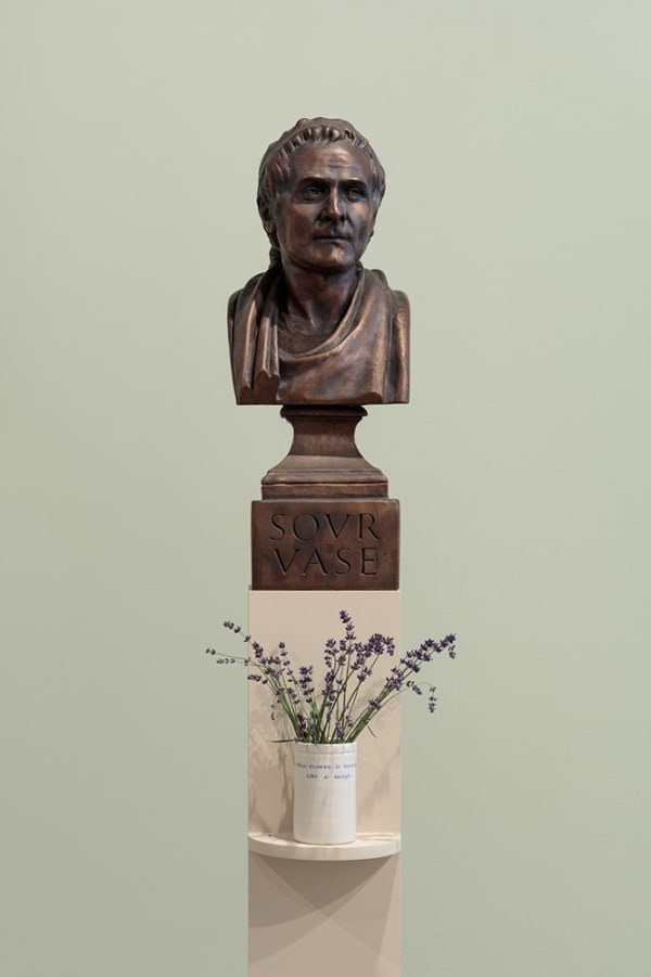 Ian Hamilton Finlay ROUSSEAU (Sour Vase) / A Wild Flower is Ideological, Like a Badge, 1991-93 cast bronze and ceramic vase (vase with David Ballantyne) cast bronze: 27 1/2 x 10 1/2 x 11 in (69.8 x 26.7 x 27.9 cm) ceramic vase: 5 1/2 x 3 3/8 in (13.9 x 8.5 cm)