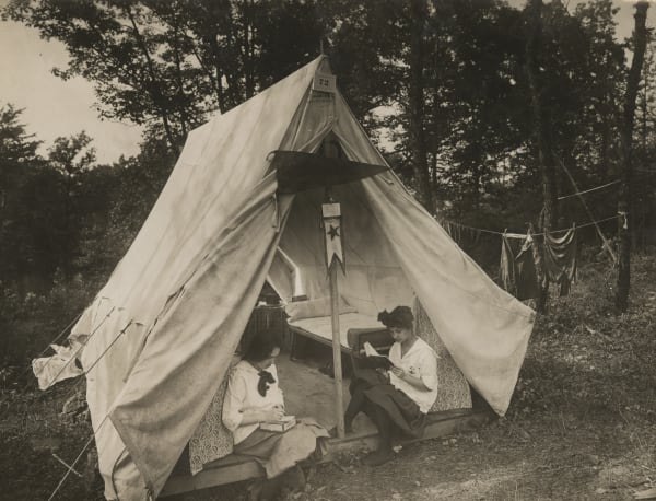 [Auto-Camping], Reading and Writing at the Campsite, c. 1920