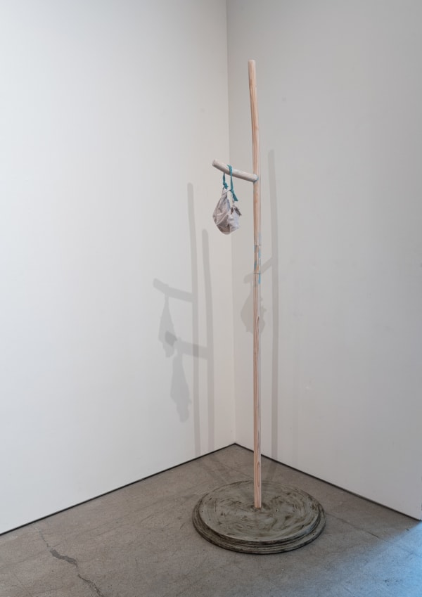 July 1, 2023 wood, concrete, fabric Covid mask, wax 81 x 24 x 24"