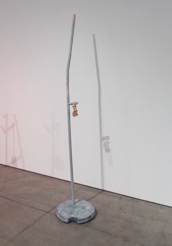 Capture, 2023 wood, Covid mask, concrete, wax 88 x 18 x 18"