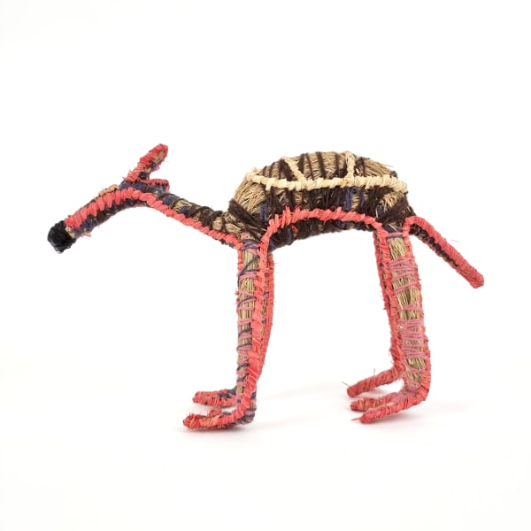 Pinuka (Margaret) Yai Yai Kamula (Camel), 2022 tjanpi (grass), acrylic wool, raffia 26 x 37 x 14 cm 10 1/4 x 14 5/8 x 5 1/2 in