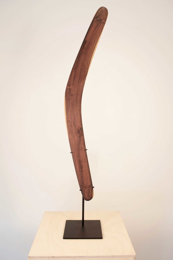 Errol Evans Kali - Boomerang, 2018 mulga wood + metal stand 76 x 14 x 1.5 cm 29 7/8 x 5 1/2 x 5/8 in