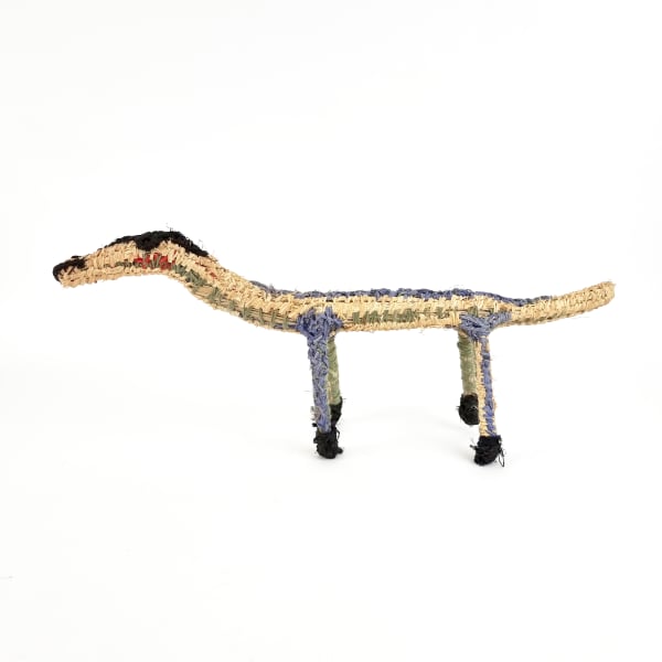 Tjunkaya Tapaya Tinka (Lizard), 2022 tjanpi (grass), acrylic wool, raffia 29 x 65 x 14 cm 11 3/8 x 25 5/8 x 5 1/2 in