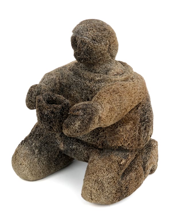 Lot 70 UNIDENTIFIED ARTIST, POSSIBLY: KANGIQTUGAAPIK (CLYDE RIVER) OR IQALUIT (FROBISHER BAY) Kneeling Figure with Vessel, 1970s whale bone, 13 x 9 x 9.5 in (33 x 22.9 x 24.1 cm) ESTIMATE: $200 — $400