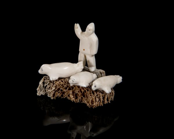 Lot 15 UNIDENTIFIED ARTIST, PROBABLY KUGAARUK (PELLY BAY) Hunter Approaching Seals, 1970s whalebone, ivory, and graphite, 1.75 x 2 x 1.25 in (4.4 x 5.1 x 3.2 cm PRICE REALIZED: $98.40