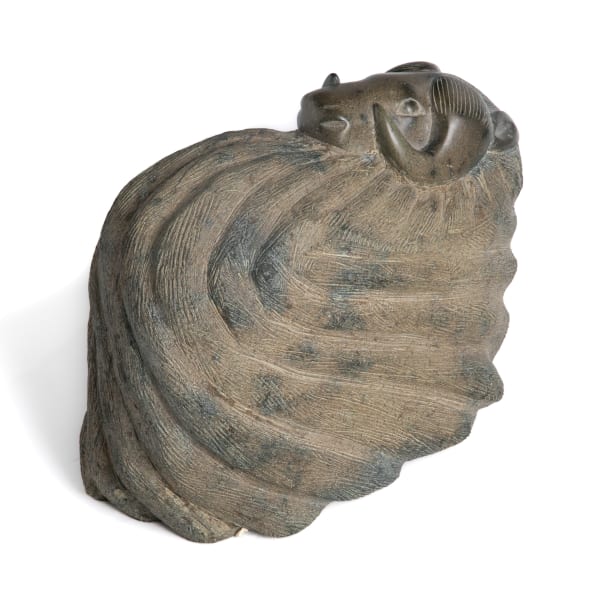 Lot 14 OSUITOK IPEELEE, R.C.A. (1923-2005) KINNGAIT (CAPE DORSET) Sheltering Muskox, early-mid 1970s stone, 11 x 13 x 6.5 (27.9 x 33 x 16.5 cm) ESTIMATE: $15,000 — $25,000