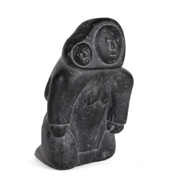 Lot 38 Possibly PUDLAT POOTOOGOOK (1919-1985) KINNGAIT (CAPE DORSET) Kneeling Mother with Child in Amaut, early-mid 1950s stone and pigment, 6.25 x 4 x 3.5 in (15.9 x 10.2 x 8.9 cm) ESTIMATE: $2,000 — $3,000